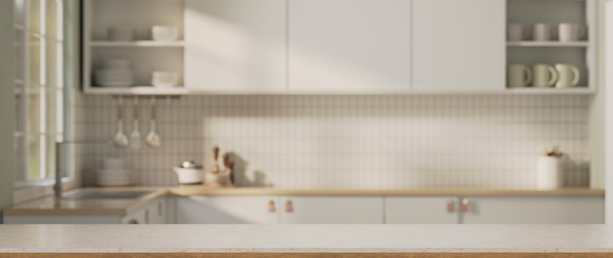 An elegant white marble kitchen countertop in a bright, modern kitchen