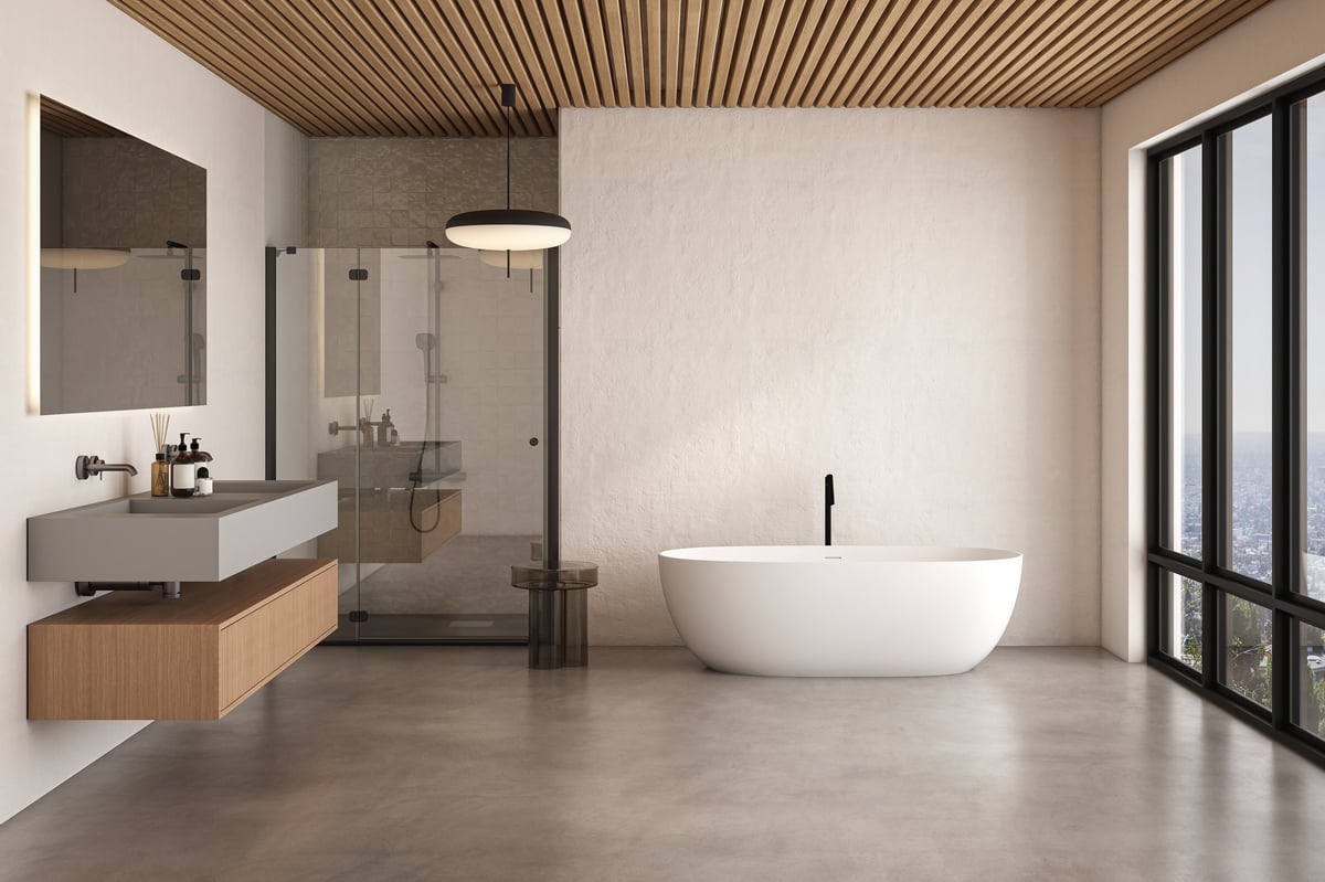 A clean modern bathroom with a freestanding bathtub and a glass shower with a rainfall shower head